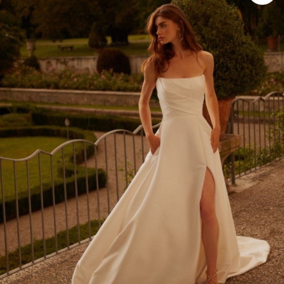 Justin Alexander Dresses & Skirts - Estelle
Strapless Mikado A-Line Wedding Dress with Pleated Bodice, Bow & Slit